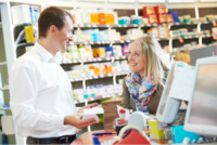 pharmacist serving the customer